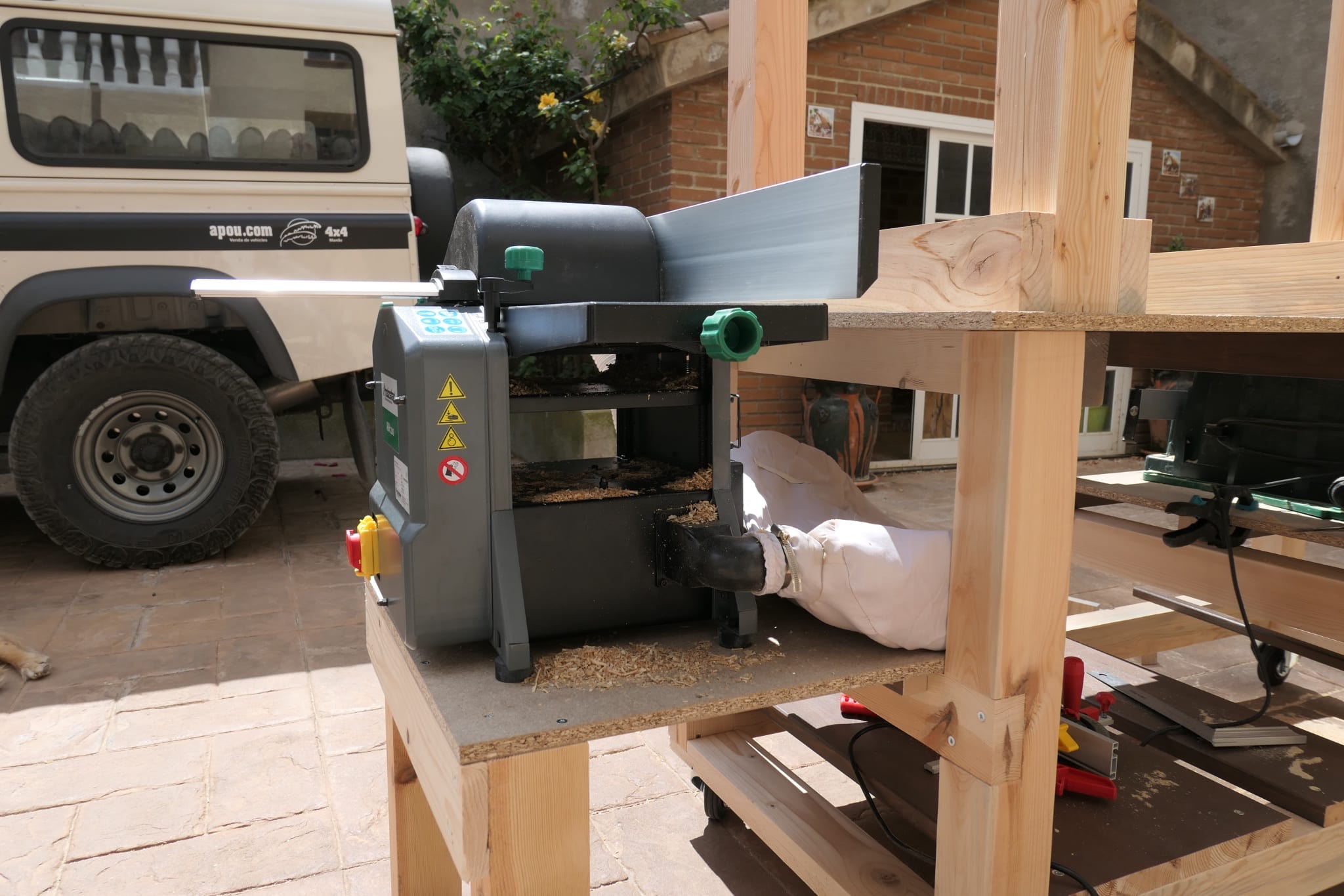 A new planer sitting on a workbench {caption: The new planer used to complete the resurfacing}